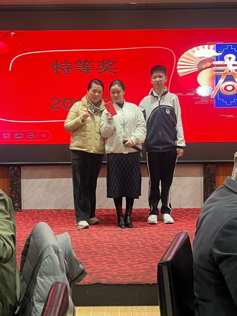 Employees and guests enjoying the prize game at Shenzhen Qixingyuan's annual dinner, celebrating company achievements with fun and prizes