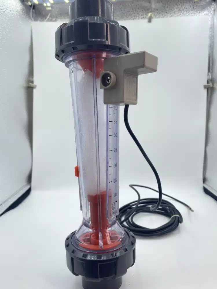 PVC flow meter for wet-line flow observation